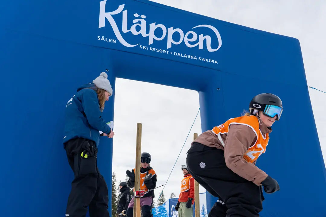 A girl has just left the start and is excited for her first run.