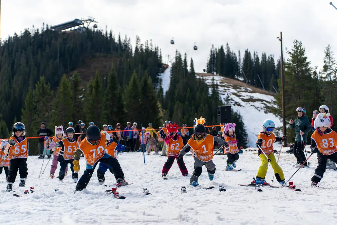 A lot of children with bib numbers and on skis who have just started in our popular Easter competition, Chinese Easter Downhill.