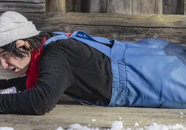 Trolle is sitting on the terrace outside Trollgården reading the newspaper.