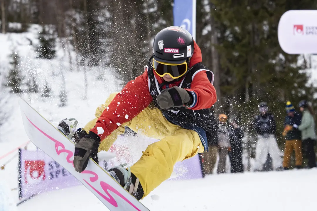 Swedish Championships in Kläppen Snowpark, a snowboarder performs tricks in the air