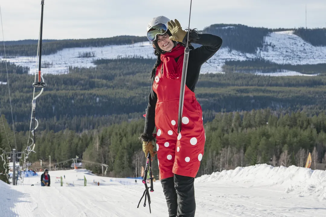 Trolla skis up in the lift and a few T-bar lifts down comes Trolle.